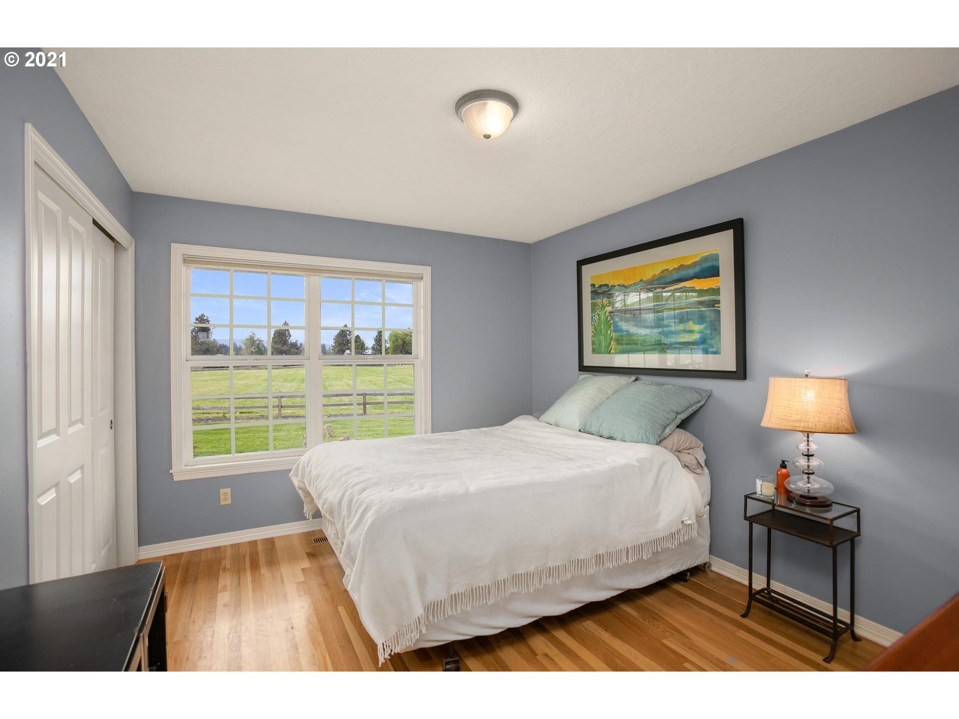 15620 Northwest Gillihan Road Portland, OR 97231 - Photo 15 of 29 a bedroom with a bed and a window