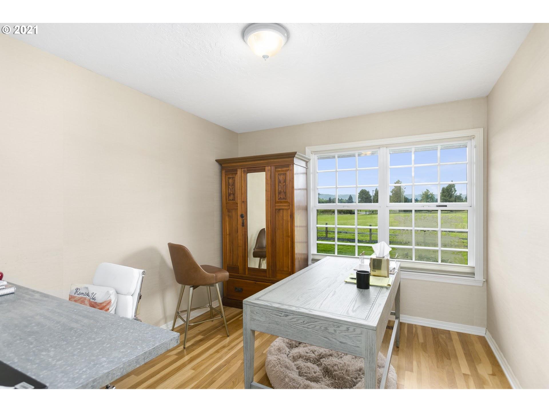 15620 Northwest Gillihan Road Portland, OR 97231 - Photo 16 of 29 a living room with furniture and a large window