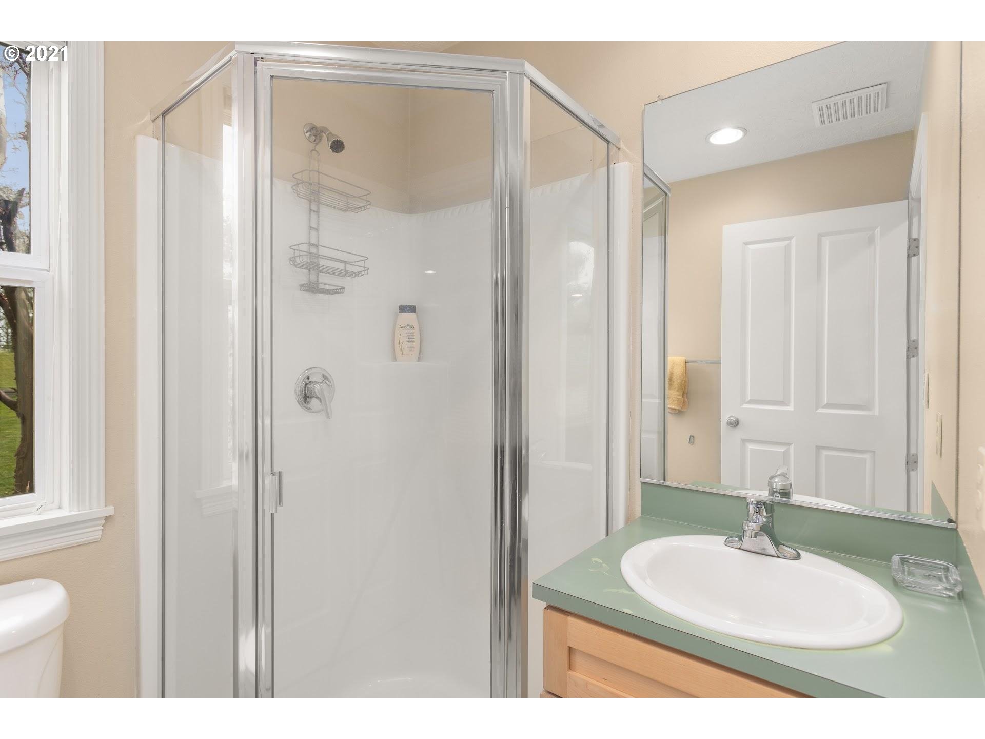 15620 Northwest Gillihan Road Portland, OR 97231 - Photo 17 of 29 a bathroom with a sink and a mirror