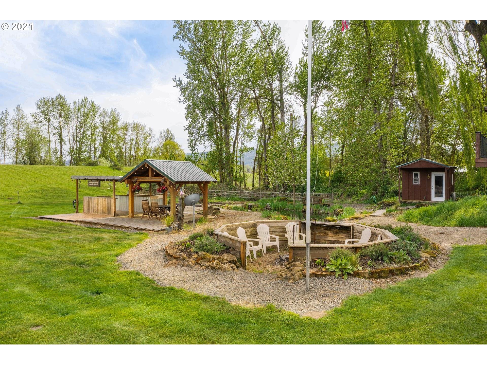 15620 Northwest Gillihan Road Portland, OR 97231 - Photo 20 of 29 a view of a house with backyard porch and sitting area