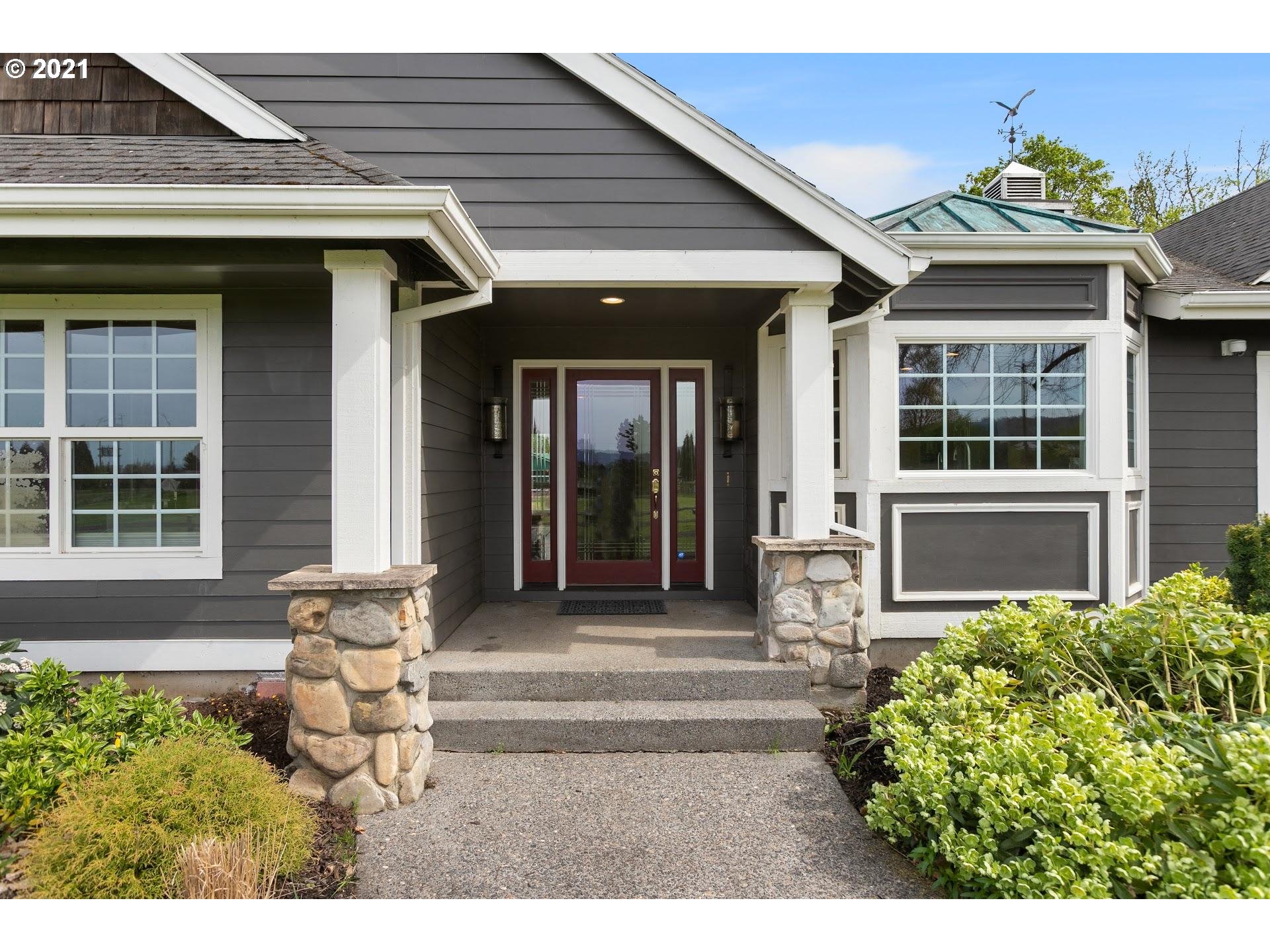 15620 Northwest Gillihan Road Portland, OR 97231 - Photo 3 of 29 a front view of a house with a yard