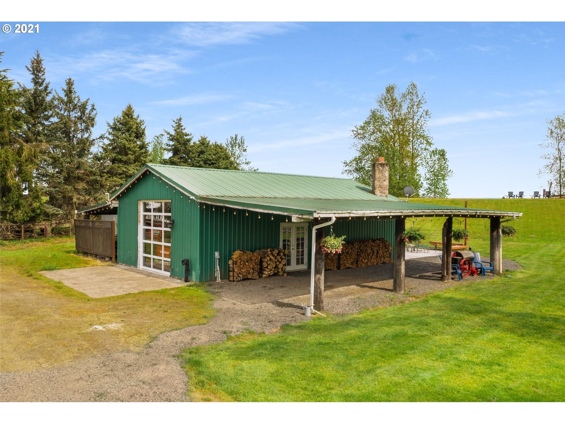 15620 Northwest Gillihan Road Portland, OR 97231 - Photo 24 of 29 a view of a house with a backyard and a patio
