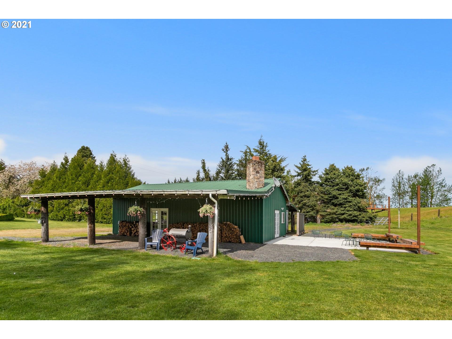 15620 Northwest Gillihan Road Portland, OR 97231 - Photo 25 of 29 a view of a swimming pool with a yard