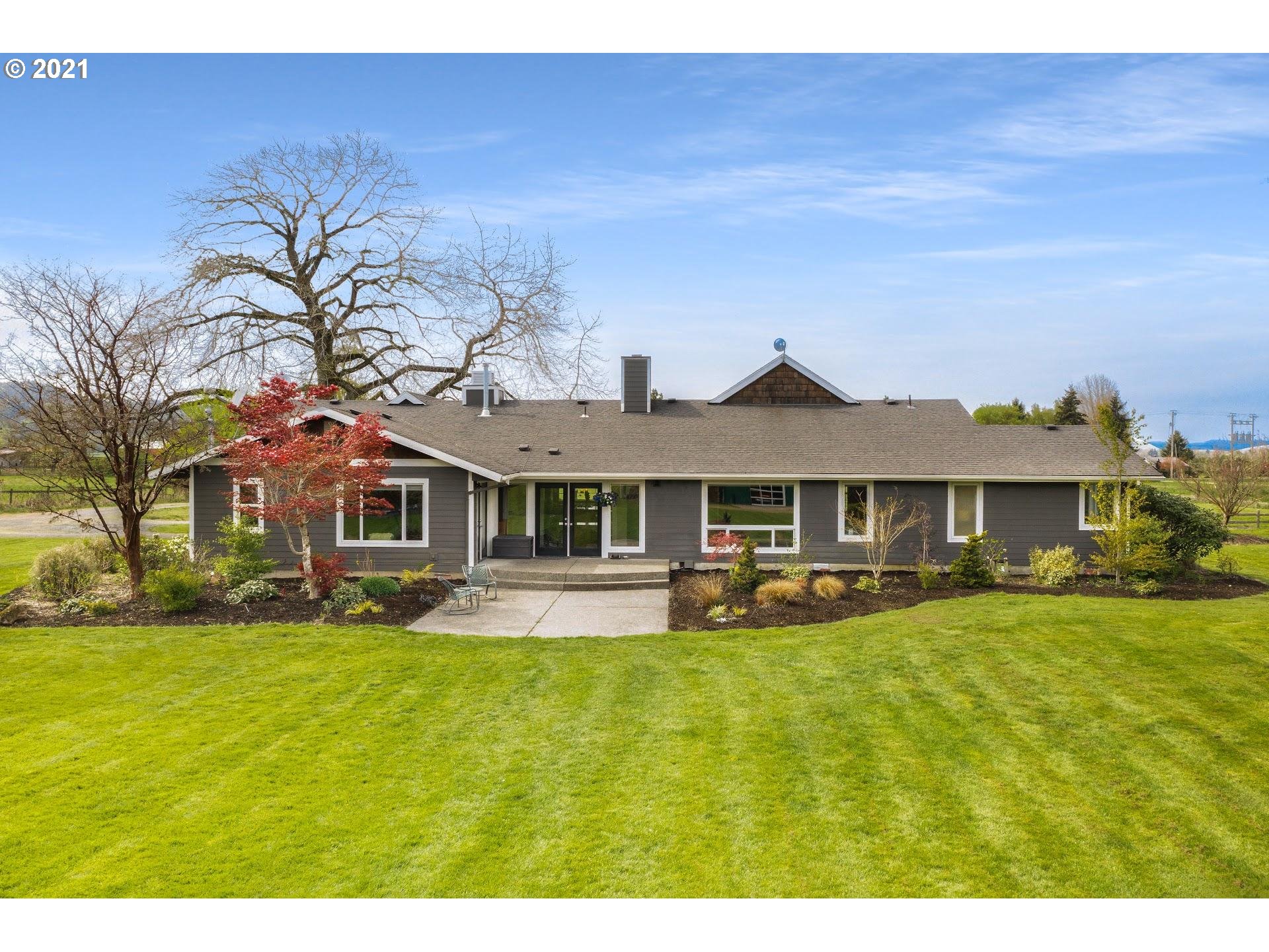 15620 Northwest Gillihan Road Portland, OR 97231 - Photo 26 of 29 a front view of a house with garden