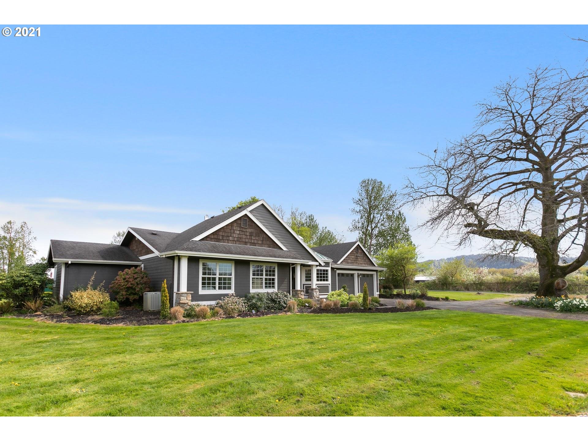 15620 Northwest Gillihan Road Portland, OR 97231 - Photo 28 of 29 a front view of a house with a garden