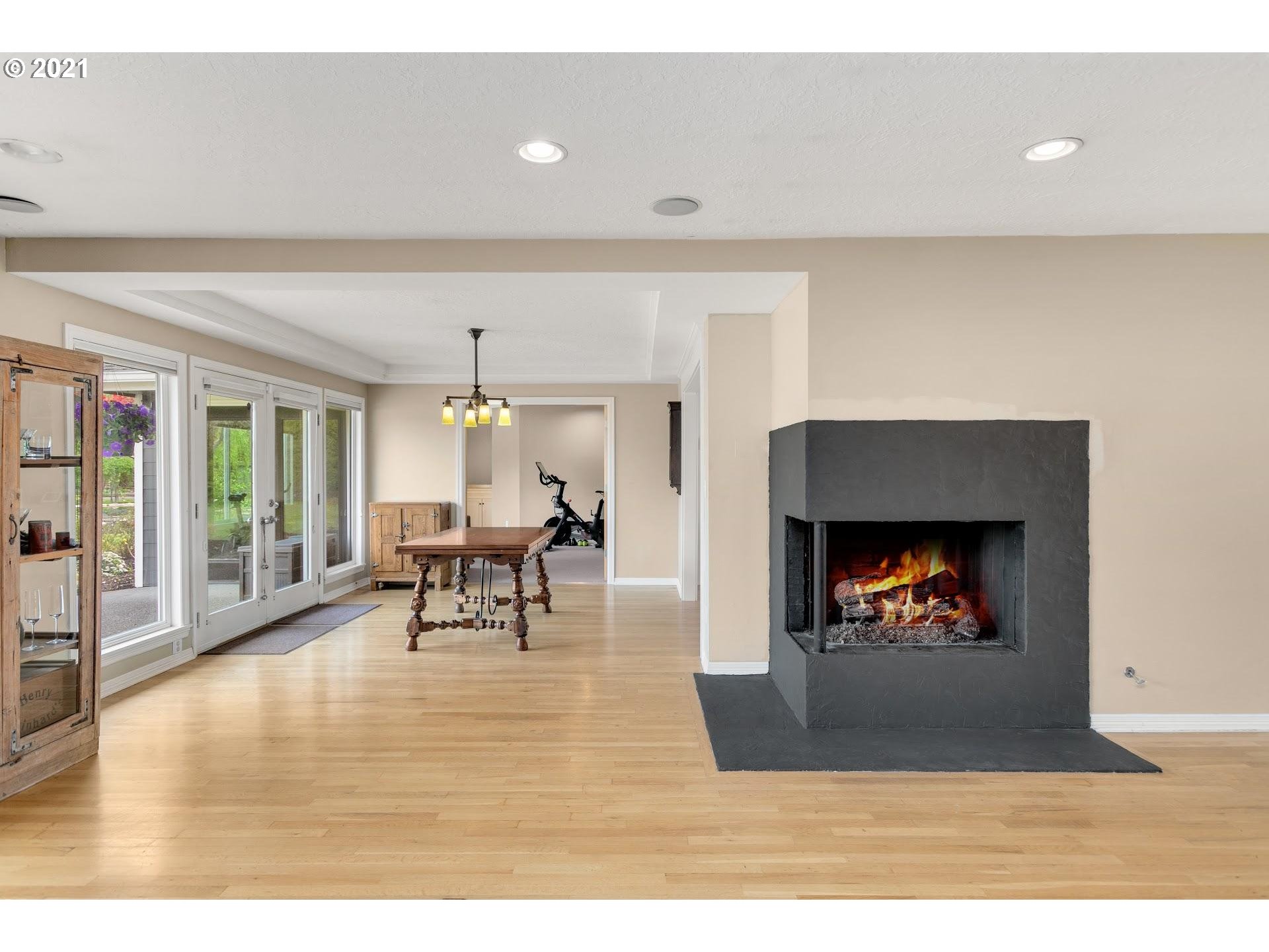 15620 Northwest Gillihan Road Portland, OR 97231 - Photo 5 of 29 a living room with furniture and a fireplace