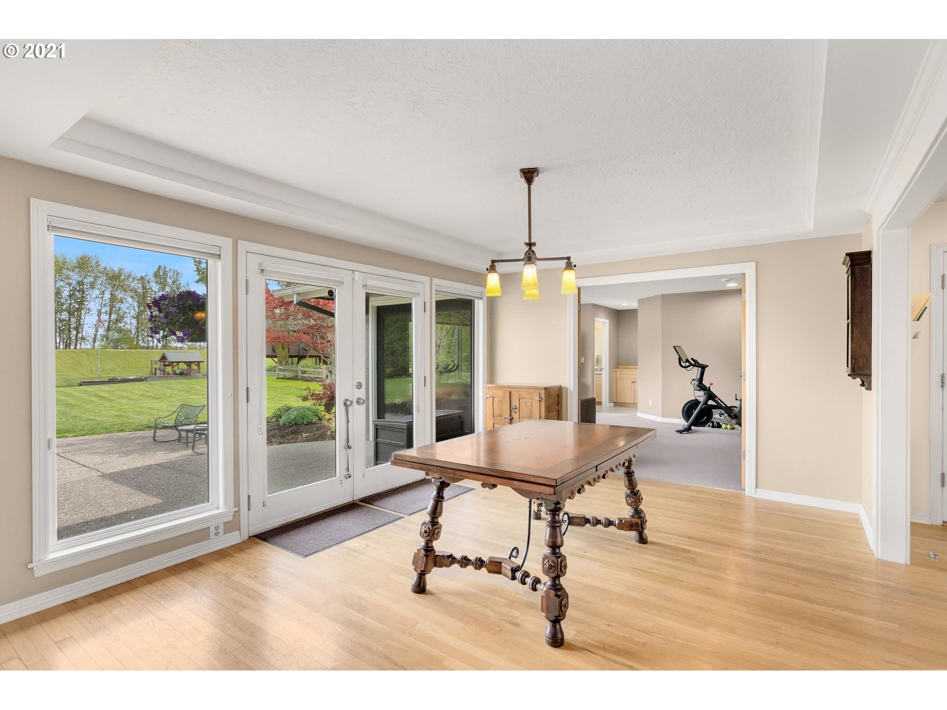15620 Northwest Gillihan Road Portland, OR 97231 - Photo 6 of 29 a living room with furniture and a floor to ceiling window