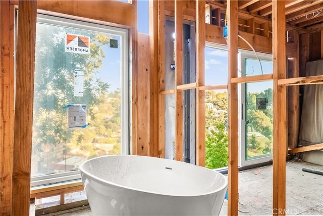 a view of a bathtub and door in a living room