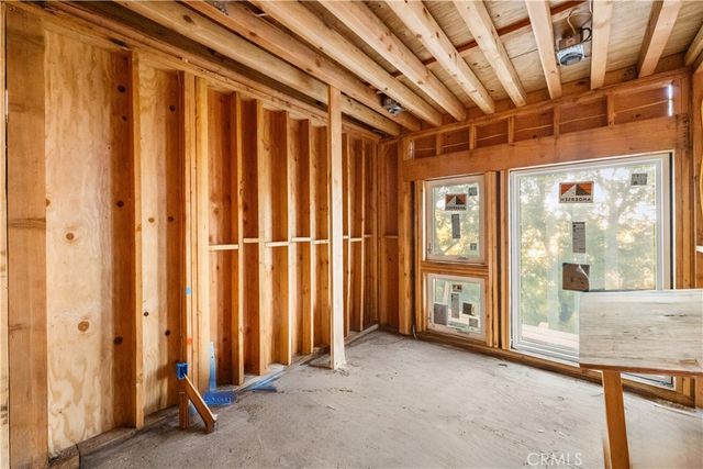 a view of a room with large windows