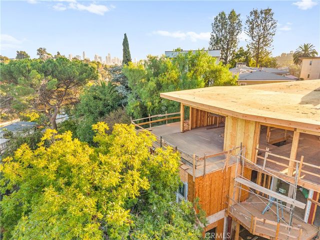 a view of a swimming pool with an outdoor seating and a yard