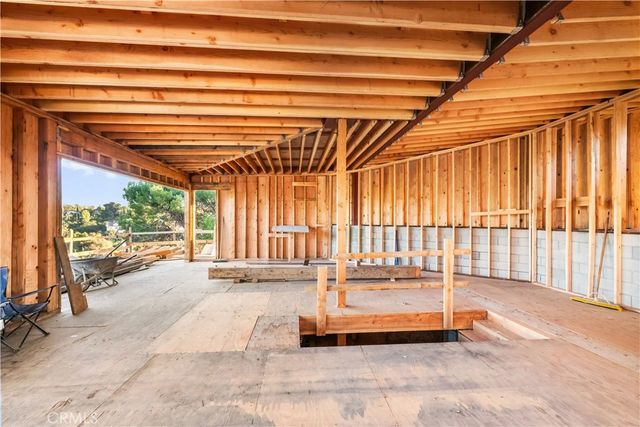 a spacious bedroom with a bed and a table