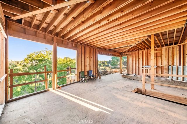 a view of a room with wooden walls