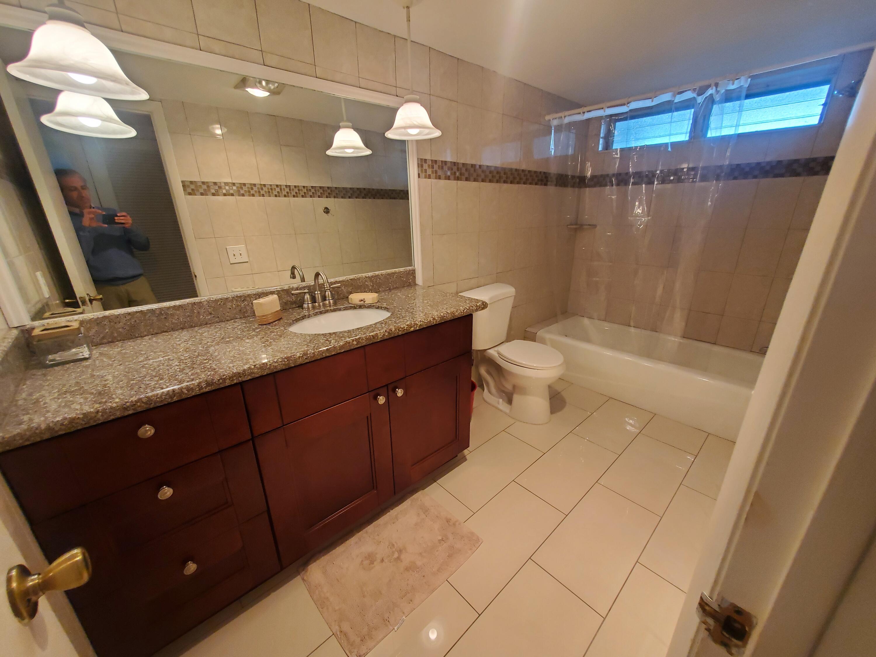 20 Southeast 13th Street, Unit A6 Boca Raton, FL 33432 - Photo 4 of 14 guest bathroom
