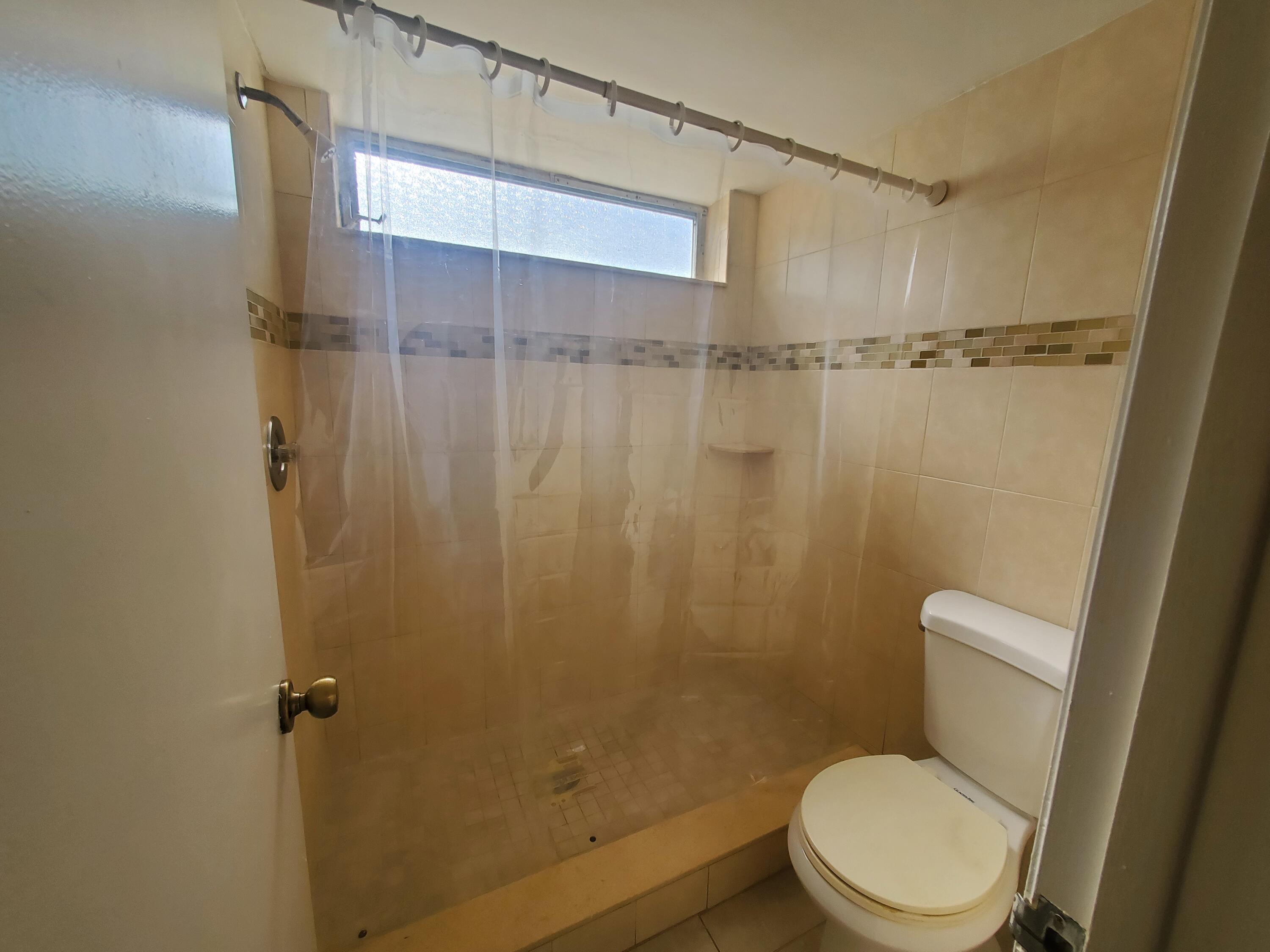 20 Southeast 13th Street, Unit A6 Boca Raton, FL 33432 - Photo 8 of 14 shower in master bathroom