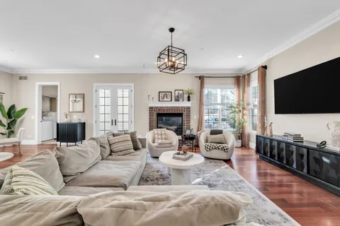 a view of a workspace with furniture and a potted plant