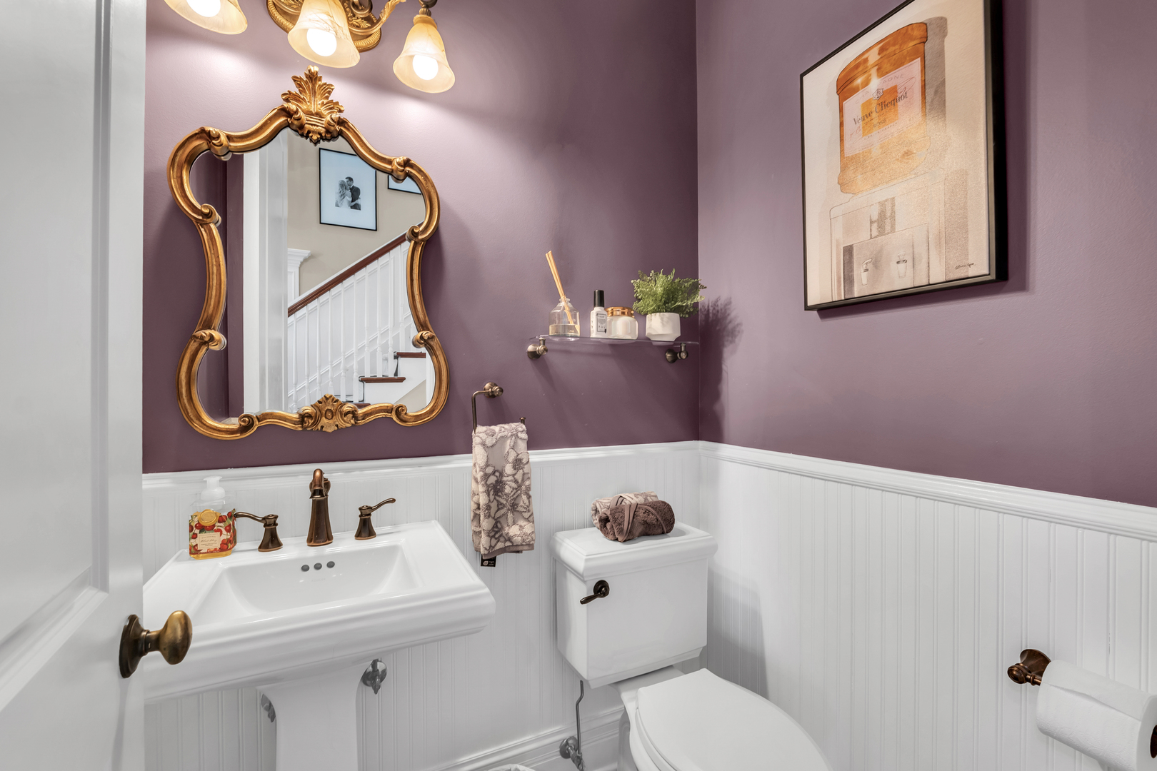 749 East Sunnyside Avenue Libertyville, IL 60048 - Photo 23 of 54 a bathroom with a sink mirror and toilet