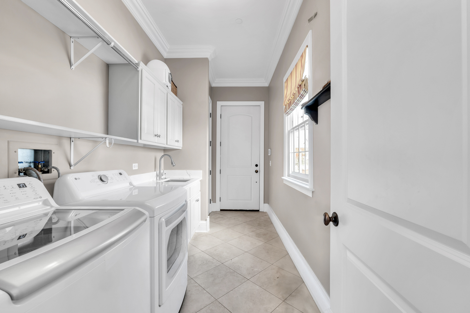 749 East Sunnyside Avenue Libertyville, IL 60048 - Photo 24 of 54 a utility room with dryer and washer