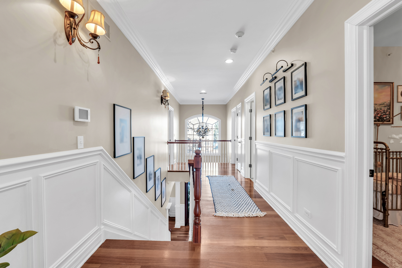 749 East Sunnyside Avenue Libertyville, IL 60048 - Photo 25 of 54 a view of a hallway with wooden floor and staircase