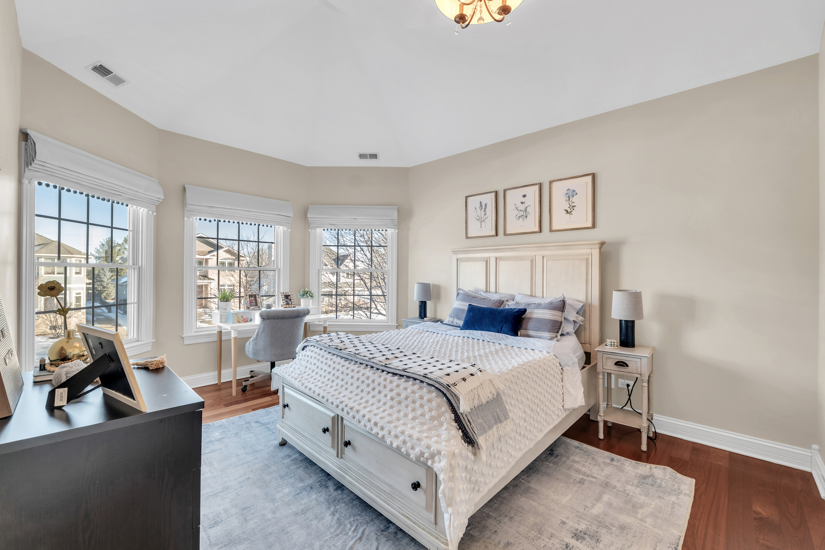749 East Sunnyside Avenue Libertyville, IL 60048 - Photo 26 of 54 a bedroom with a large bed and a couch