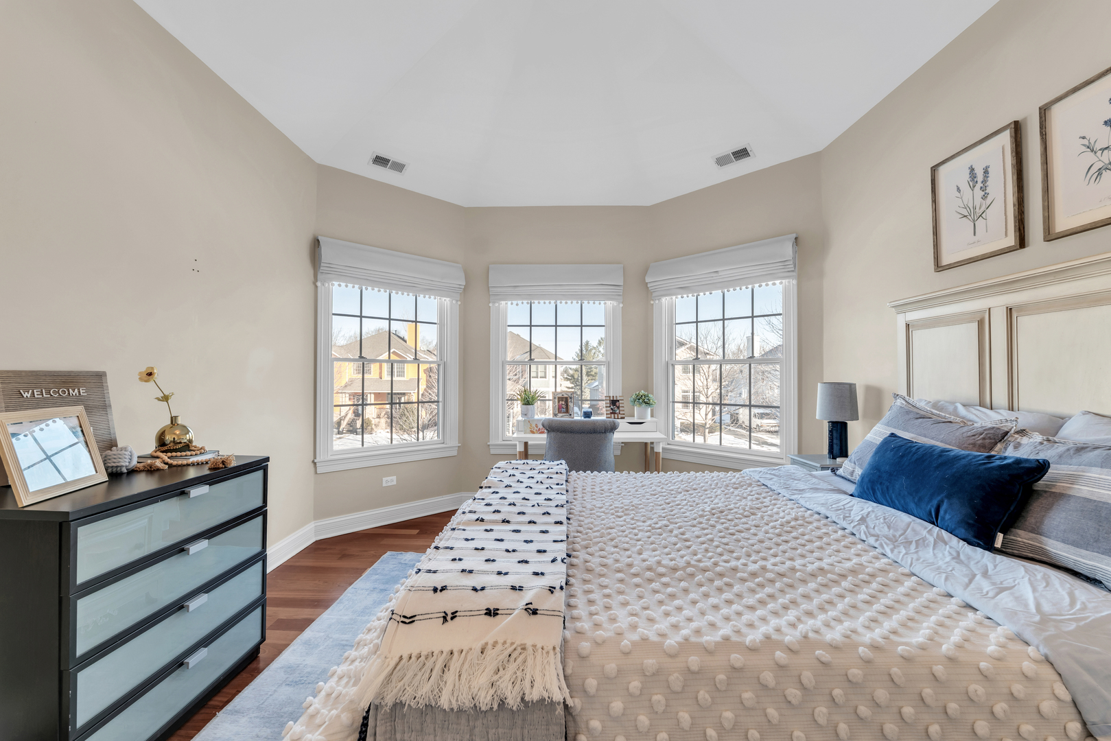 749 East Sunnyside Avenue Libertyville, IL 60048 - Photo 27 of 54 a bedroom with a bed and wooden floor