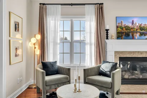 a bedroom with furniture and a fireplace