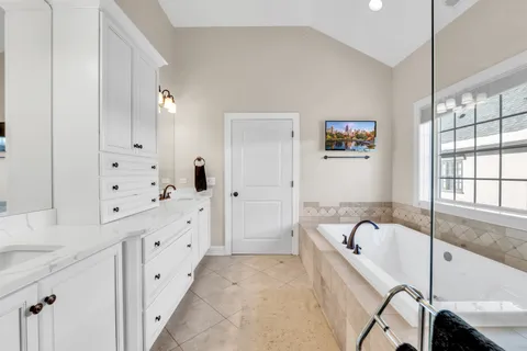 a bathroom with a sink vanity and a mirror