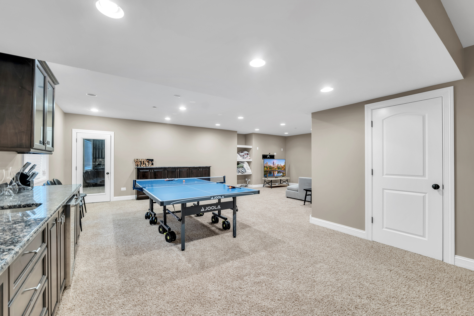 749 East Sunnyside Avenue Libertyville, IL 60048 - Photo 40 of 54 a living room with furniture and a flat screen tv