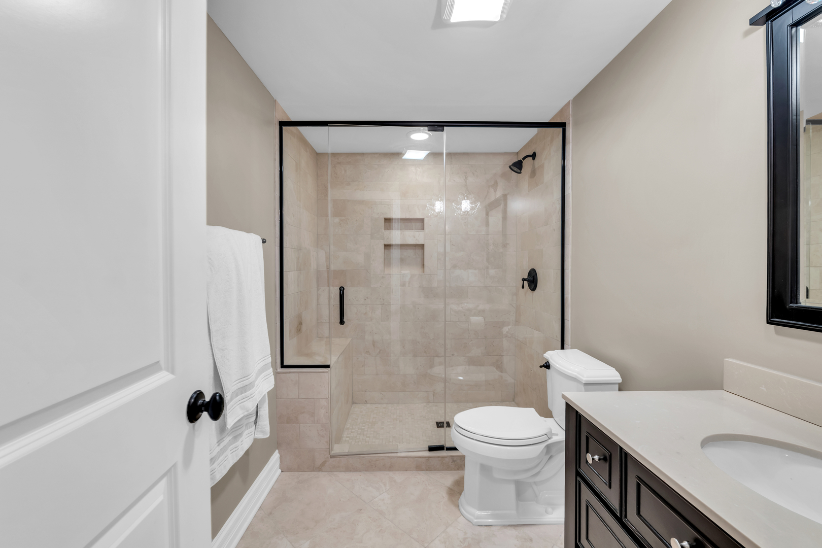 749 East Sunnyside Avenue Libertyville, IL 60048 - Photo 45 of 54 a bathroom with a sink a toilet and shower