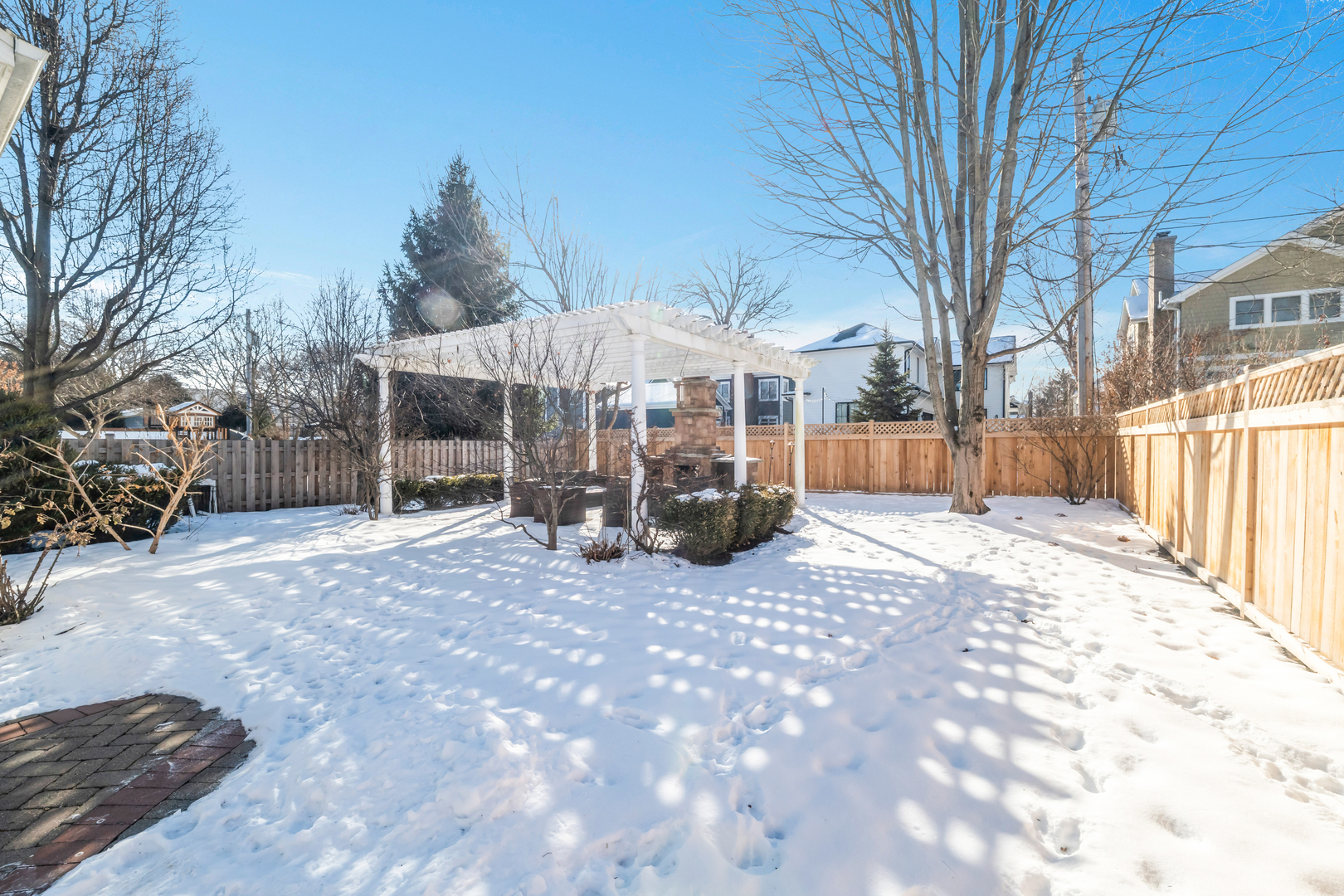 749 East Sunnyside Avenue Libertyville, IL 60048 - Photo 46 of 54 a view of a house with a yard covered in snow