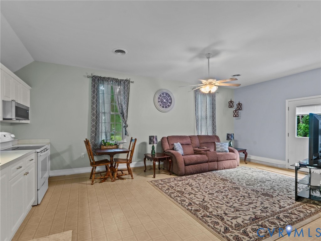 3420 State Rte 656 Powhatan, VA 23139 - Photo 26 of 37 a living room with furniture and a table