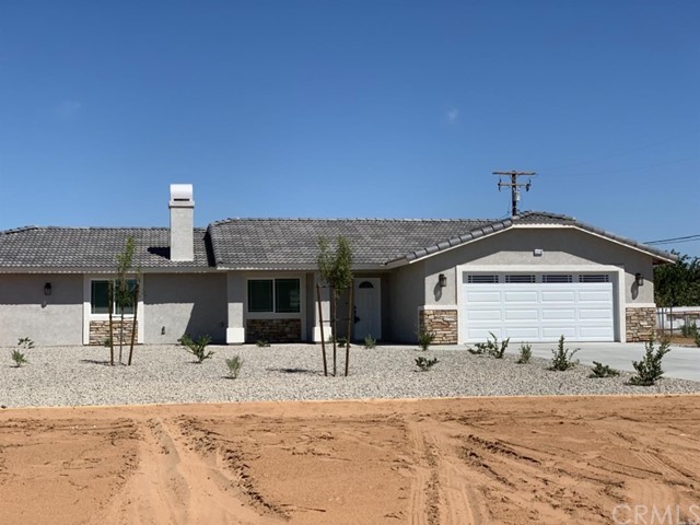 22765 Motnocab Road Apple Valley, CA 92307 - Photo 1 of 1 a front view of a house with a patio