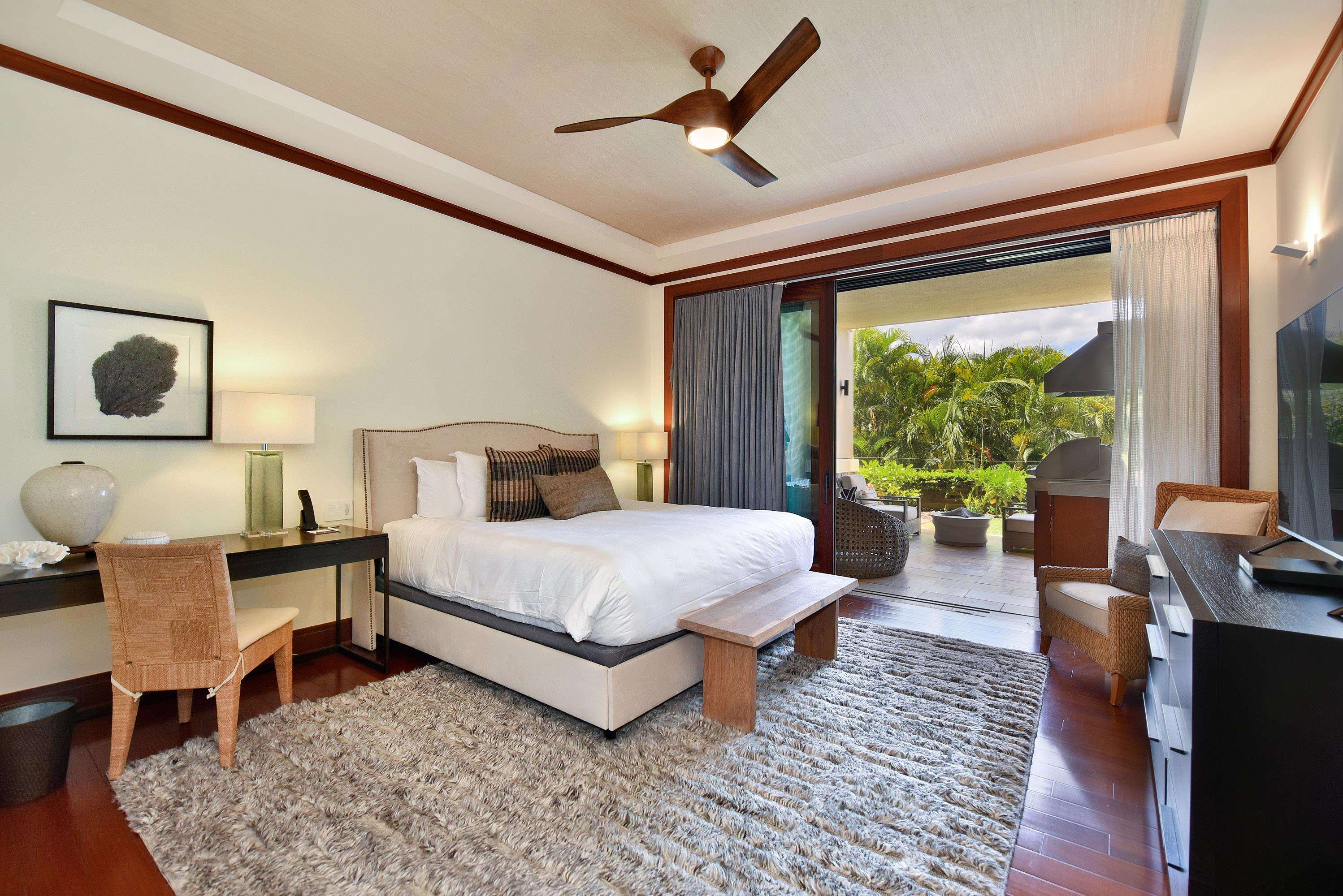 1 Bay Drive, Unit 5102 Lahaina, HI 96761 - Photo 15 of 50 a bedroom with a bed a large window with table and chairs