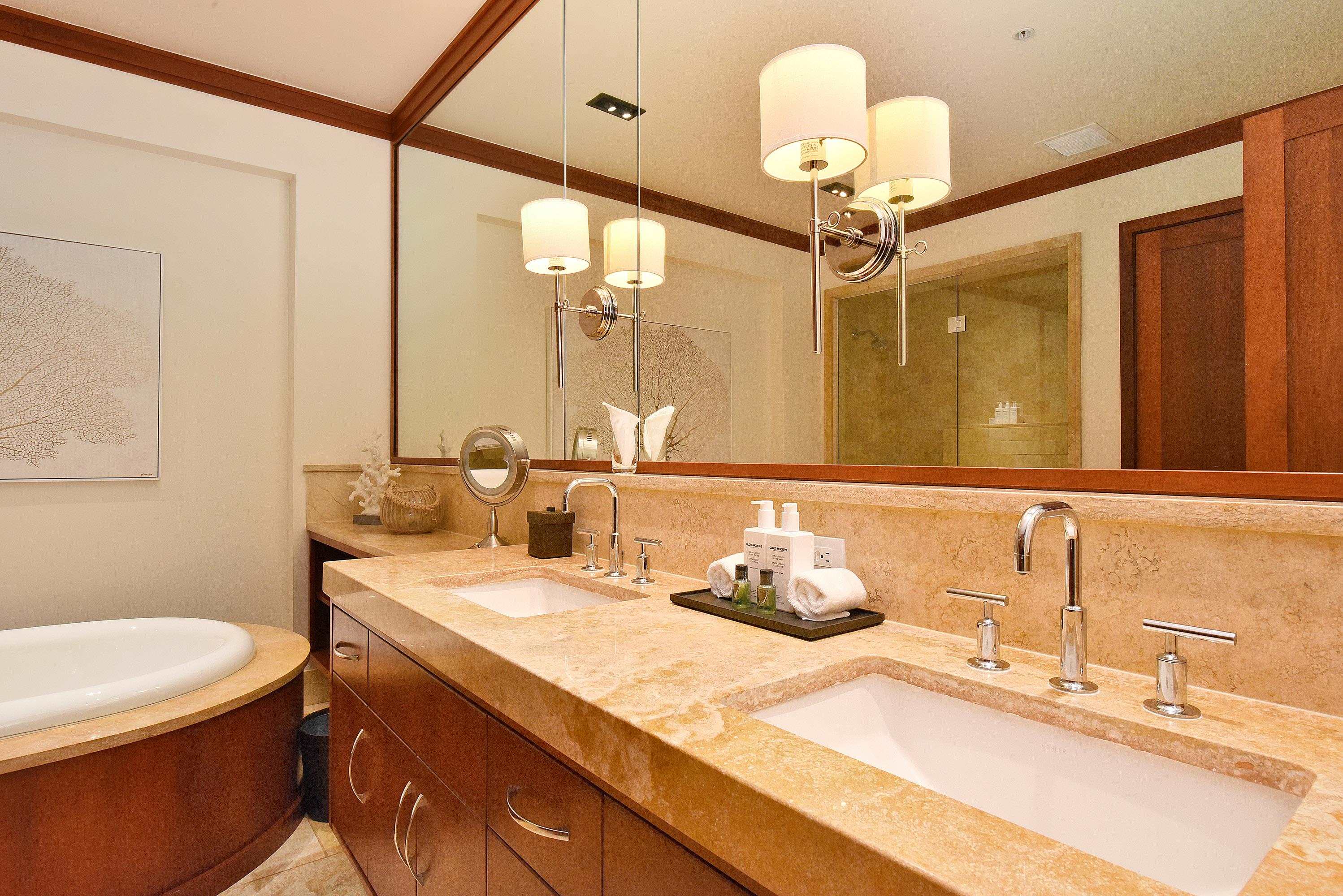 1 Bay Drive, Unit 5102 Lahaina, HI 96761 - Photo 18 of 50 a bathroom with a sink and a mirror