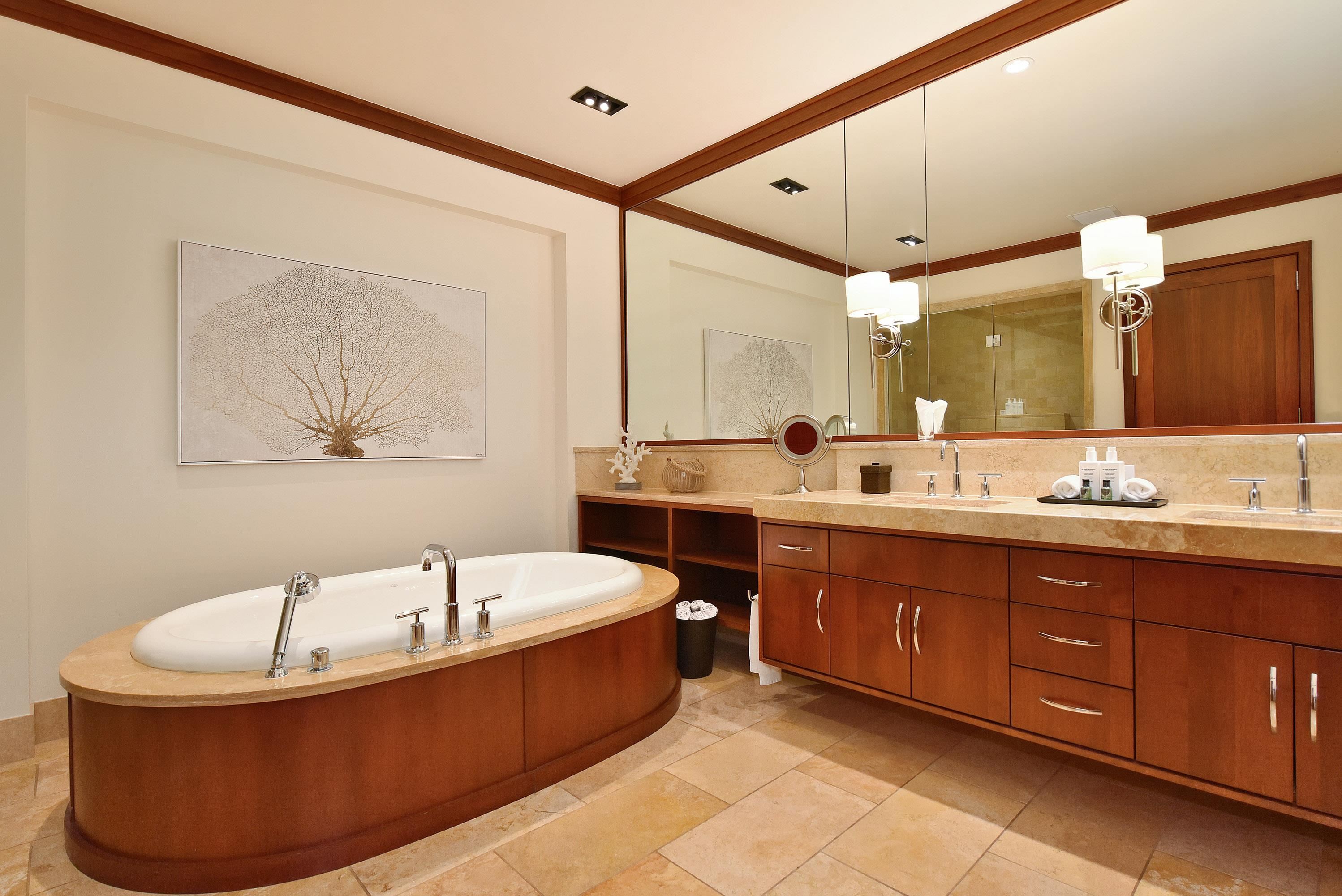 1 Bay Drive, Unit 5102 Lahaina, HI 96761 - Photo 19 of 50 a bathroom with a tub sink and mirror