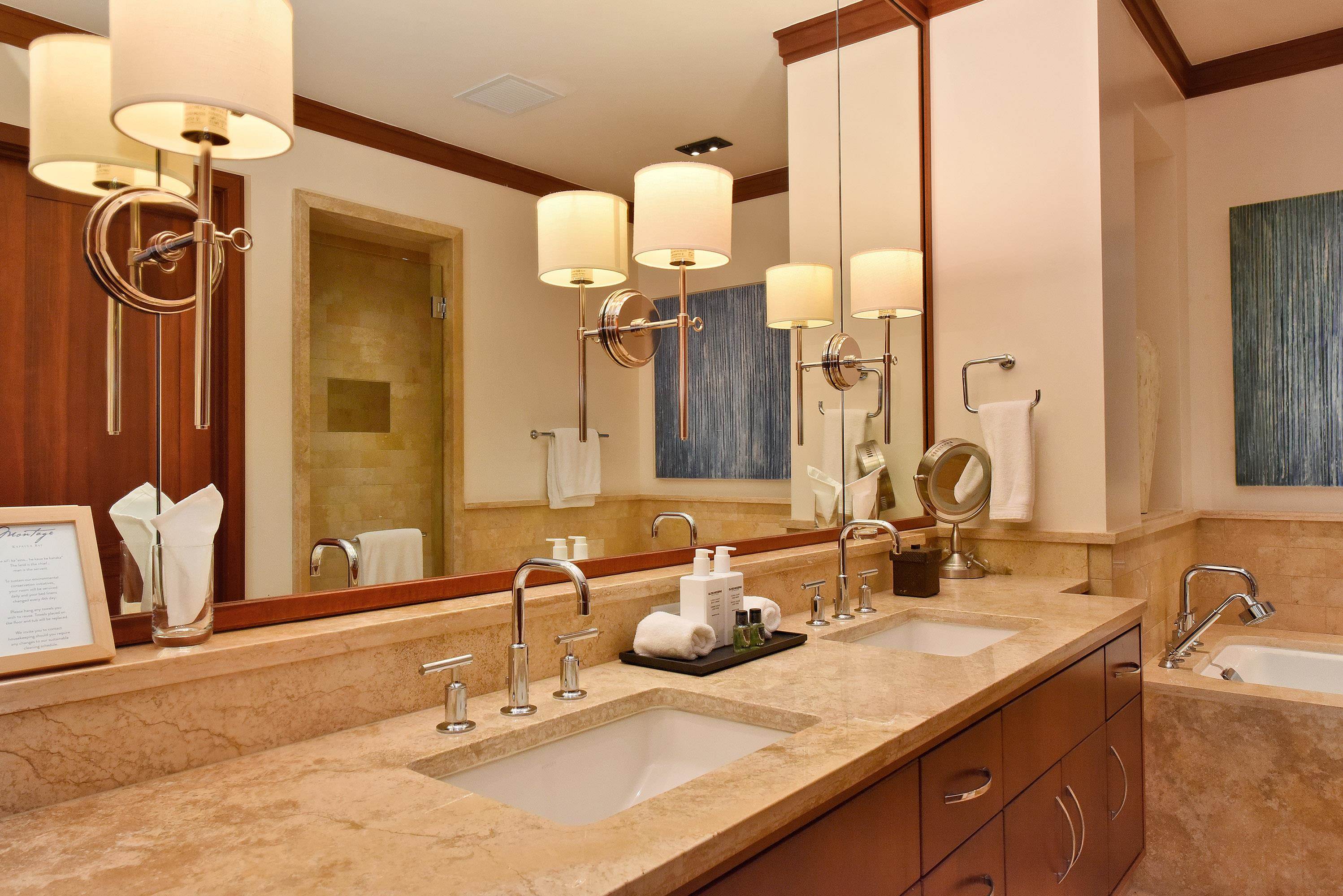 1 Bay Drive, Unit 5102 Lahaina, HI 96761 - Photo 22 of 50 a bathroom with a double vanity sink and a mirror