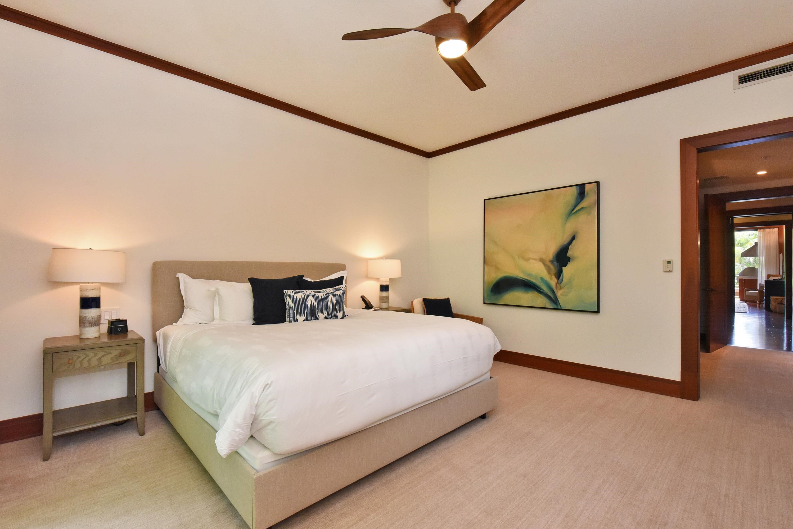 1 Bay Drive, Unit 5102 Lahaina, HI 96761 - Photo 23 of 50 a bedroom with a bed and a painting on the wall
