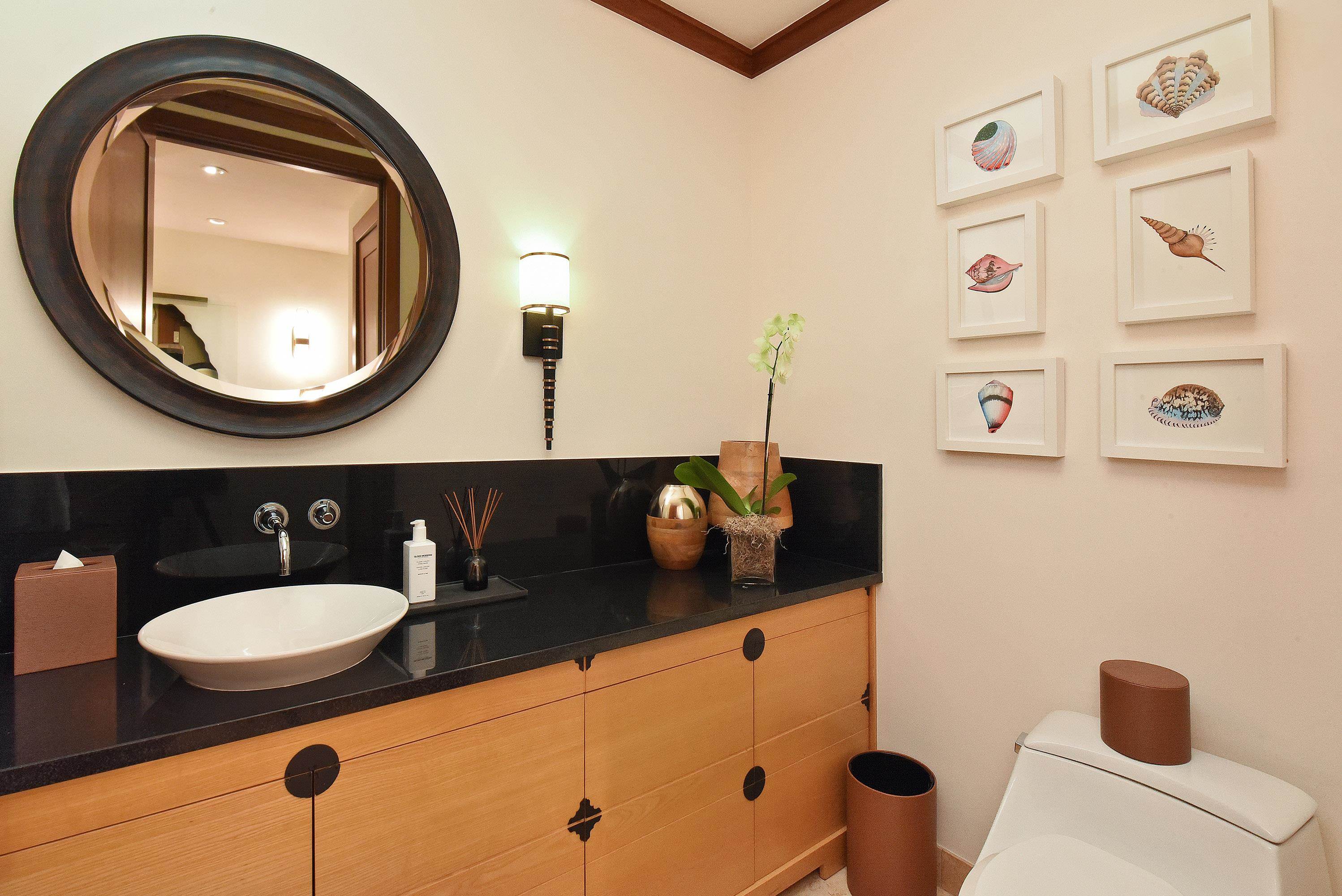 1 Bay Drive, Unit 5102 Lahaina, HI 96761 - Photo 28 of 50 a bathroom with a toilet sink and mirror