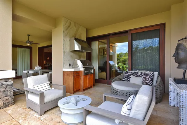 a view of a patio with a dining table and chairs