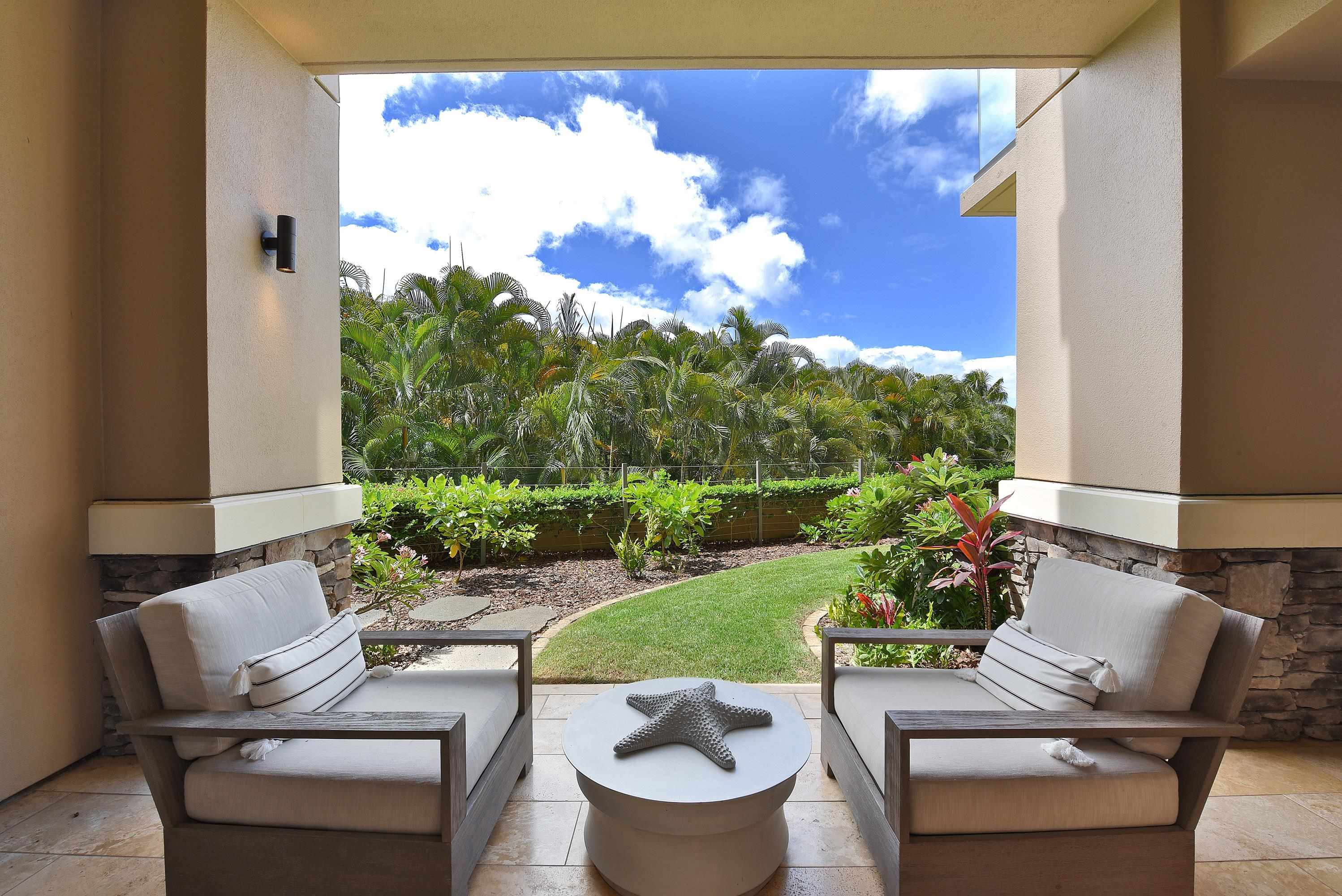 1 Bay Drive, Unit 5102 Lahaina, HI 96761 - Photo 36 of 50 a view of a chairs and table in a backyard