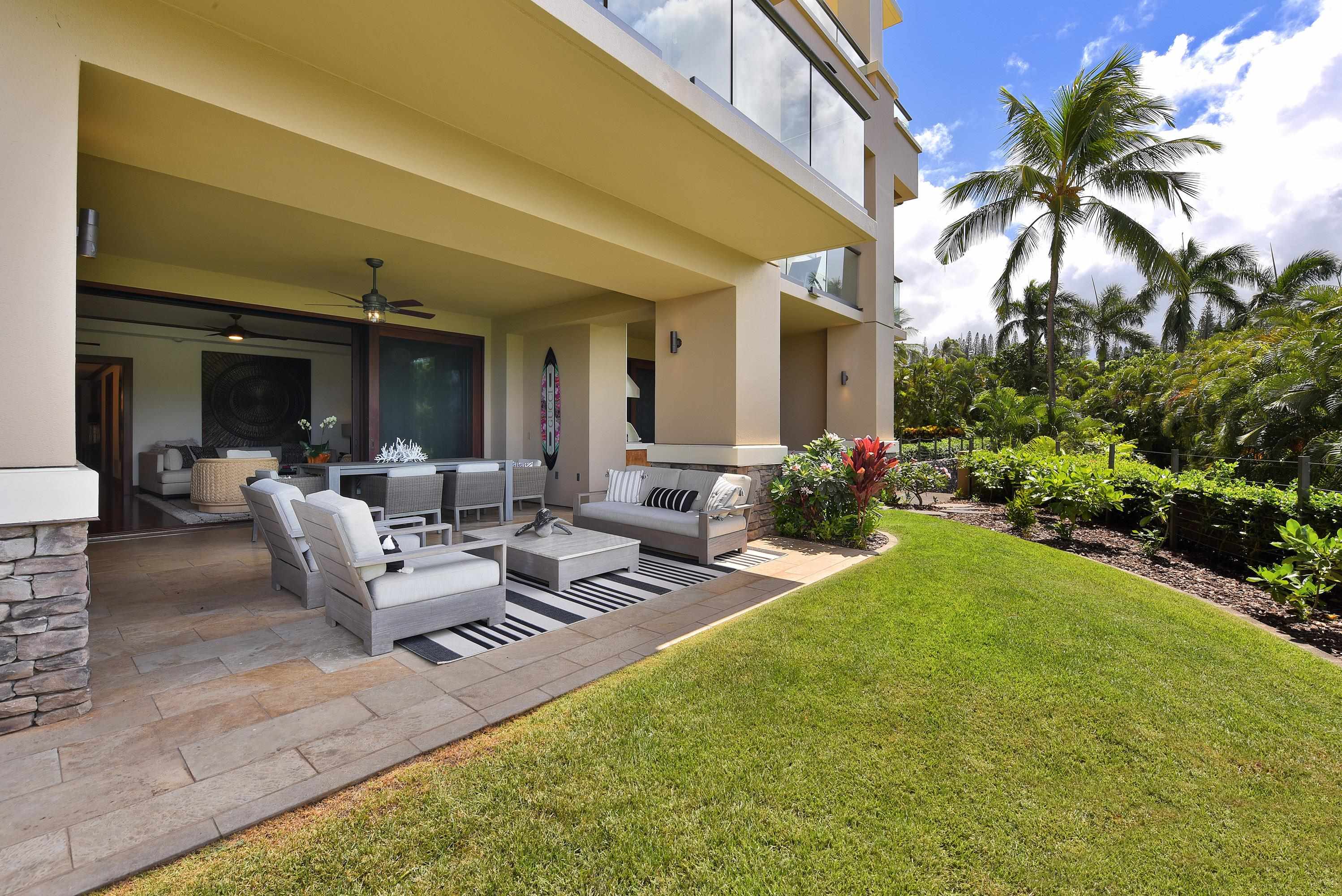 1 Bay Drive, Unit 5102 Lahaina, HI 96761 - Photo 37 of 50 a view of a patio with couches table and chairs and potted plants