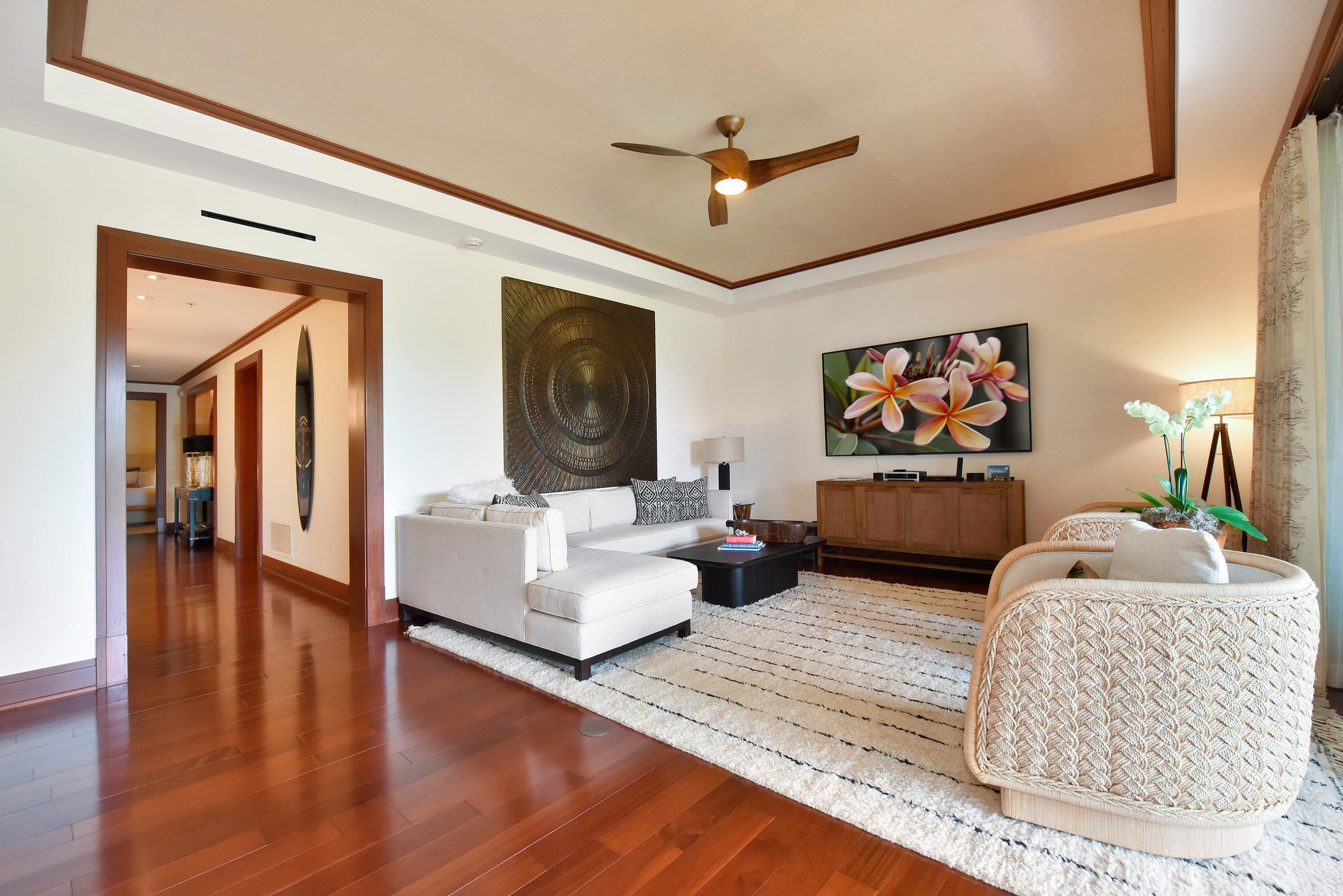 1 Bay Drive, Unit 5102 Lahaina, HI 96761 - Photo 4 of 50 a living room with furniture and a flat screen tv