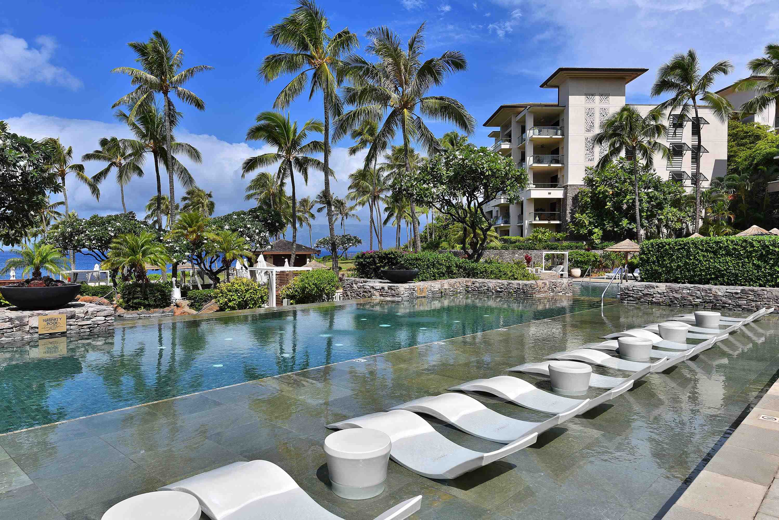 1 Bay Drive, Unit 5102 Lahaina, HI 96761 - Photo 47 of 50 a view of a lake with couches and swimming pool