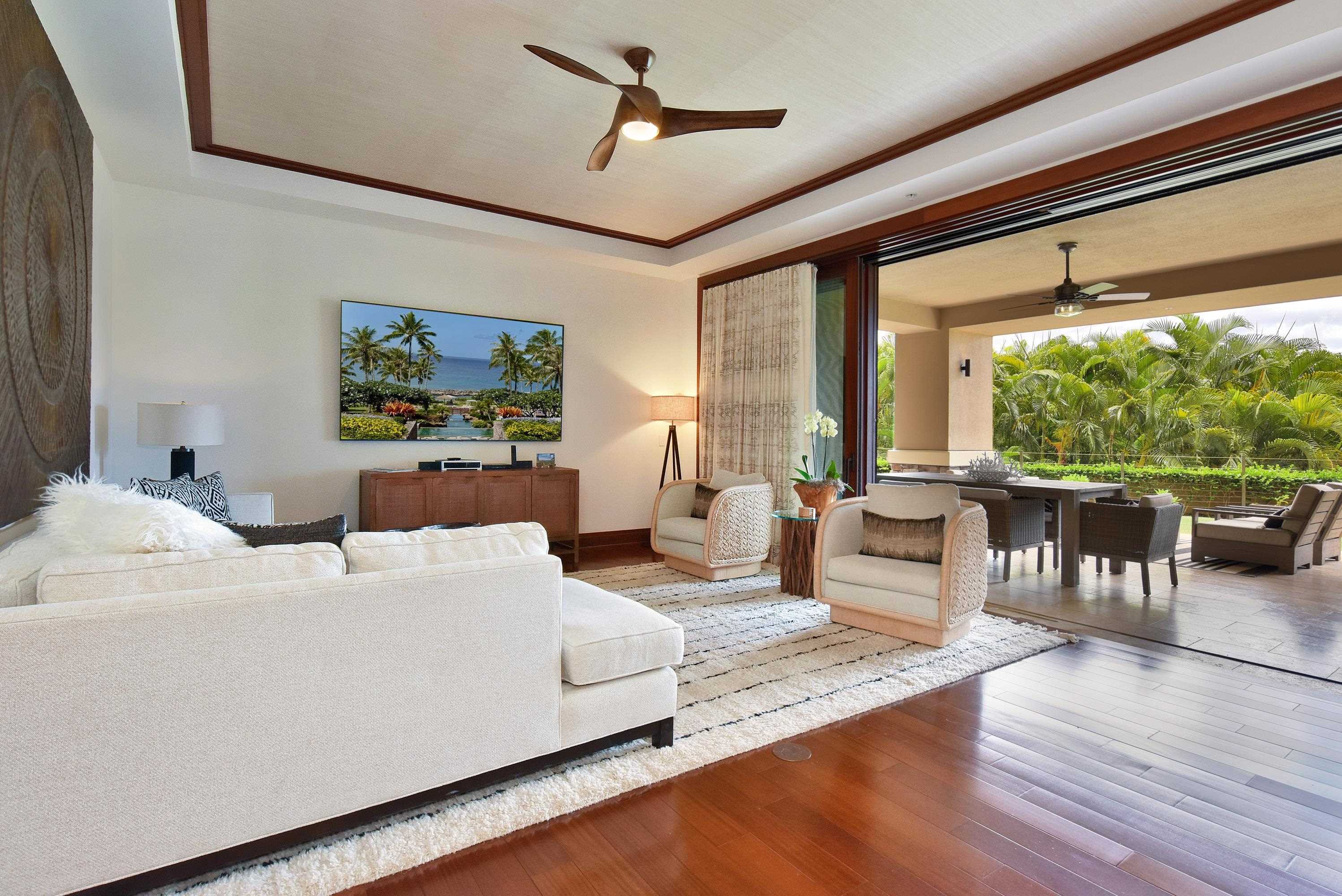 1 Bay Drive, Unit 5102 Lahaina, HI 96761 - Photo 6 of 50 a living room with furniture and a large window