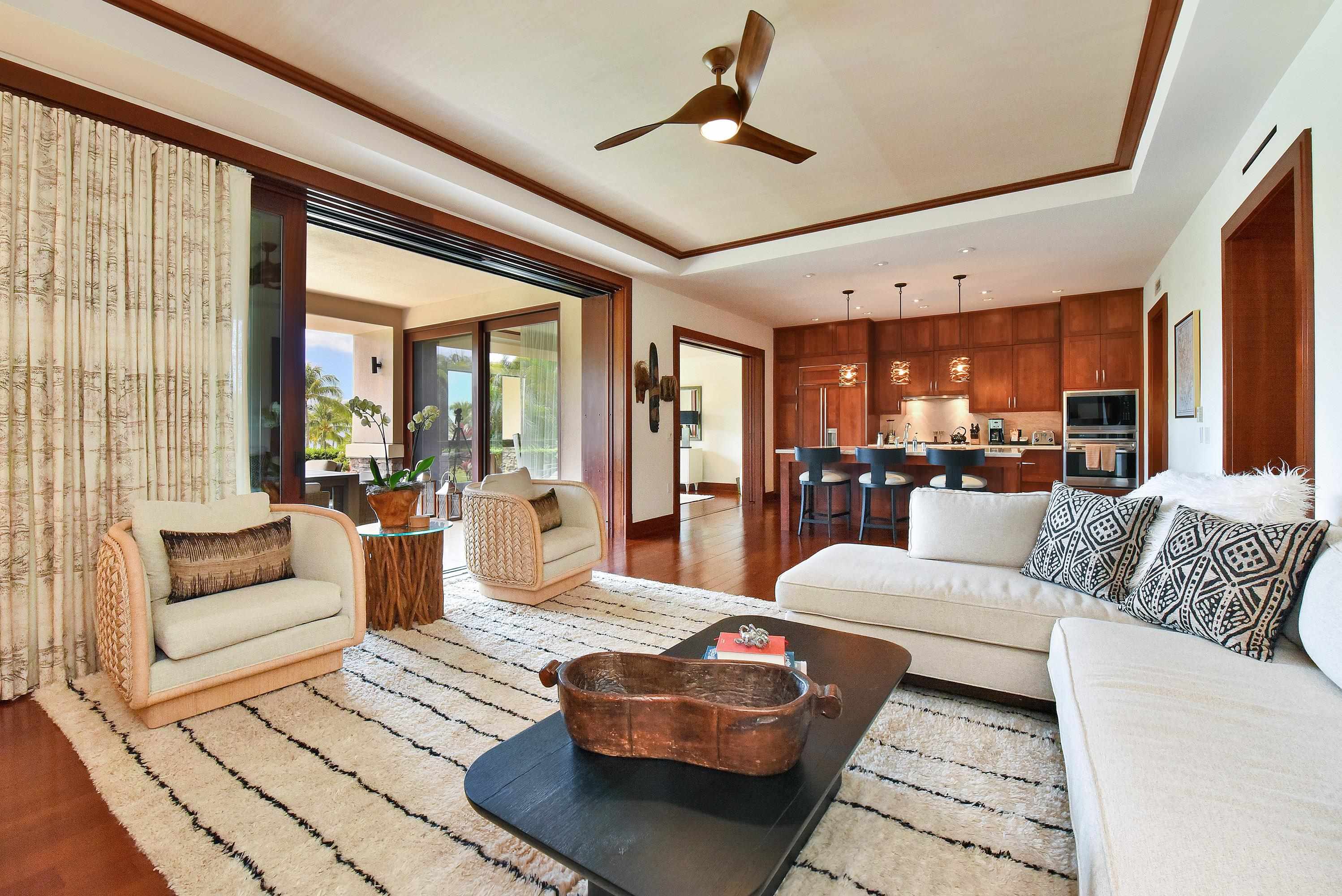 1 Bay Drive, Unit 5102 Lahaina, HI 96761 - Photo 7 of 50 a living room with furniture and a large window