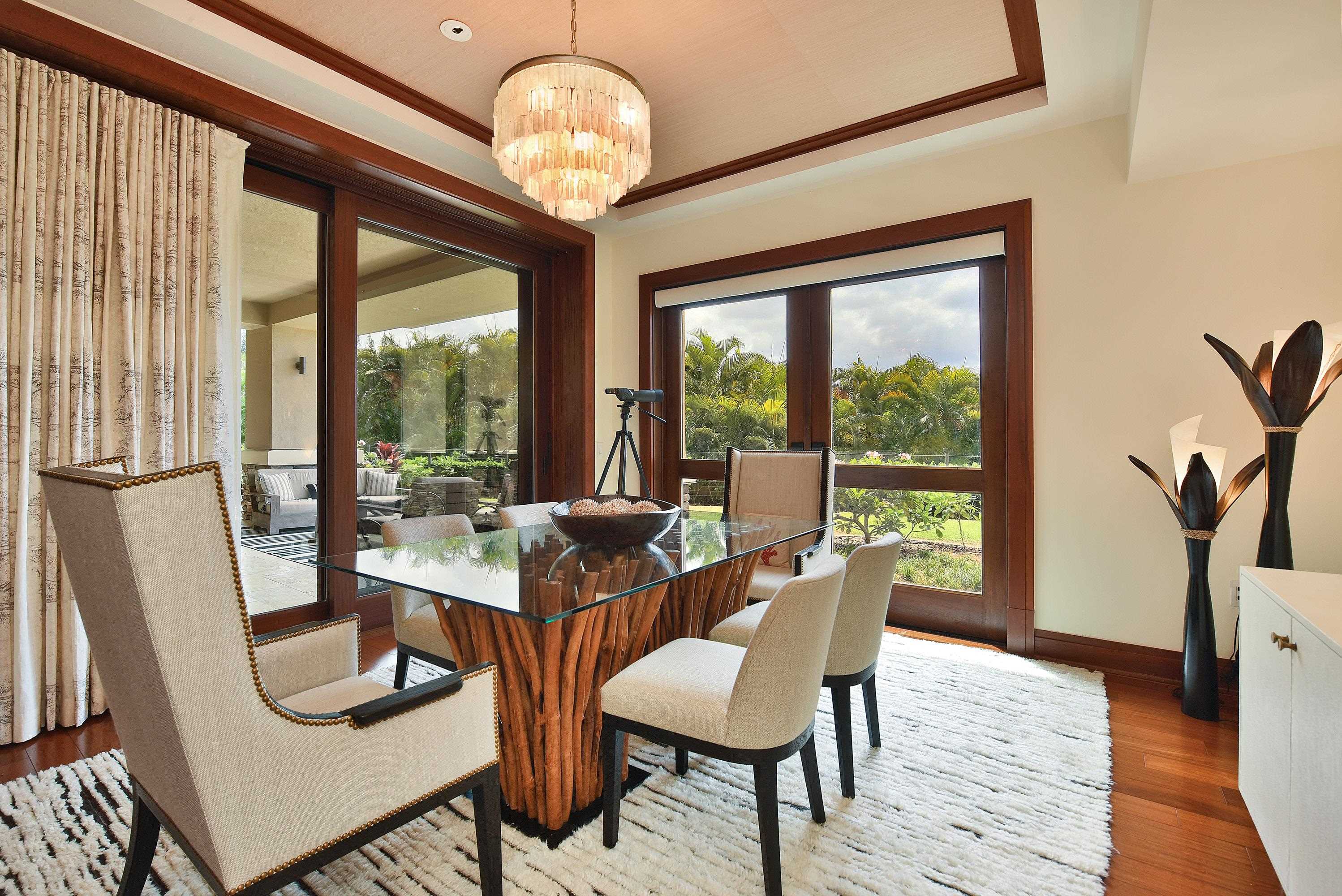 1 Bay Drive, Unit 5102 Lahaina, HI 96761 - Photo 8 of 50 a view of a dining room with furniture wooden floor and chandelier