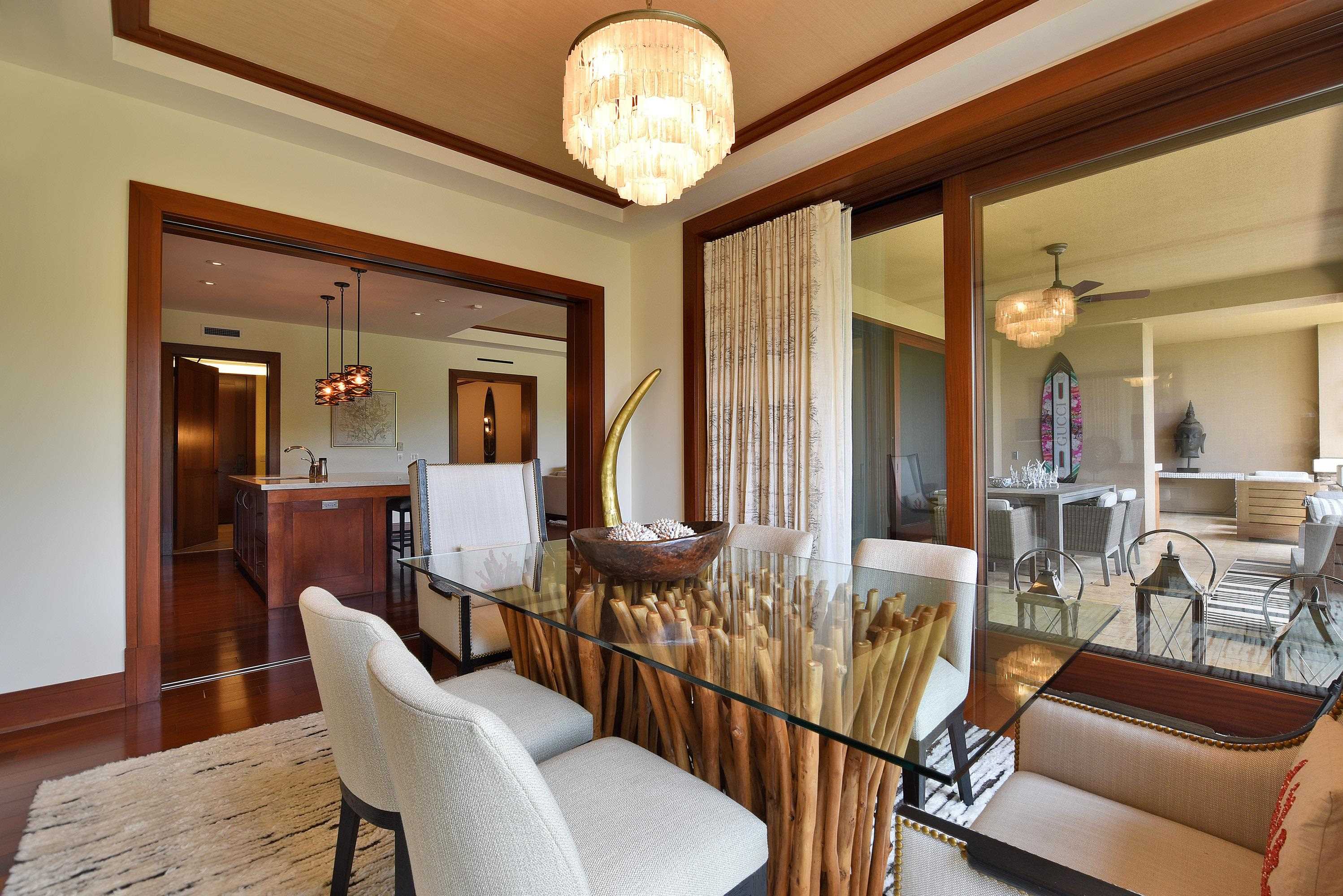 1 Bay Drive, Unit 5102 Lahaina, HI 96761 - Photo 9 of 50 a view of a dining room with furniture wooden floor and chandelier