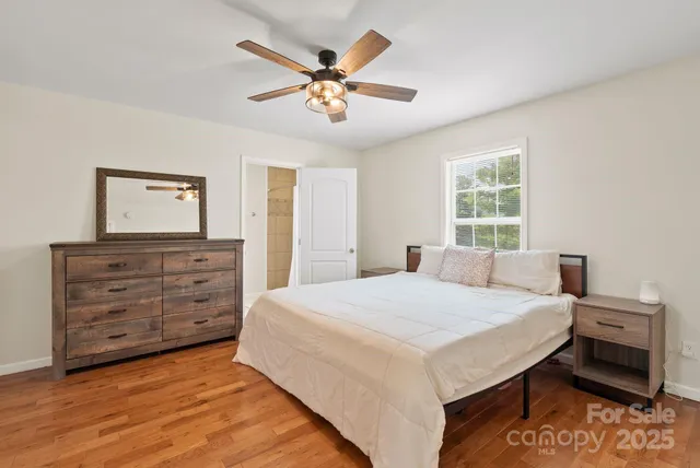 a bed room with a bed and a dresser