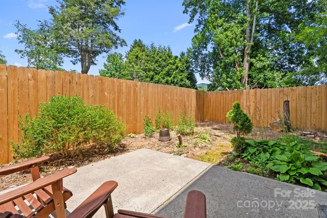 a view of outdoor seating area with green trees