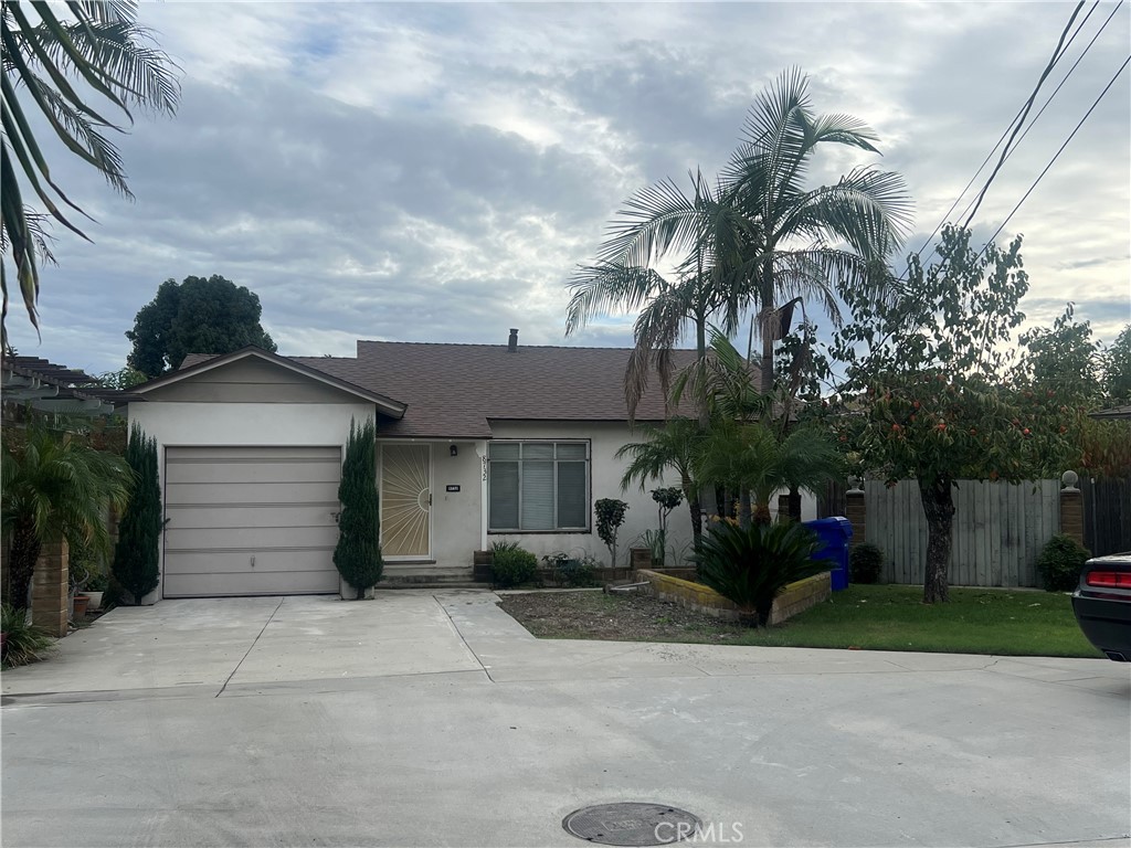 8732 Duarte Road San Gabriel, CA 91775 - Photo 3 of 6 a front view of a house with a yard and a garage