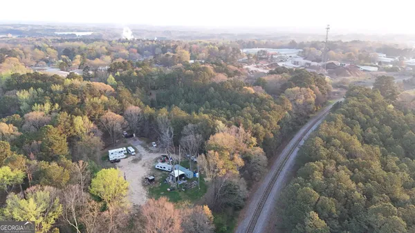a backyard of a house with lots of trees
